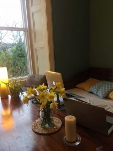 Photo of kitchen table with laptop 