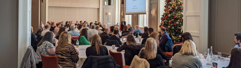 A room of conference attendees