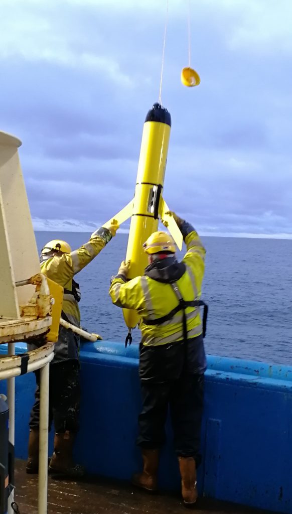 Crew recovering Autonomous underwater vehicle (AUV)