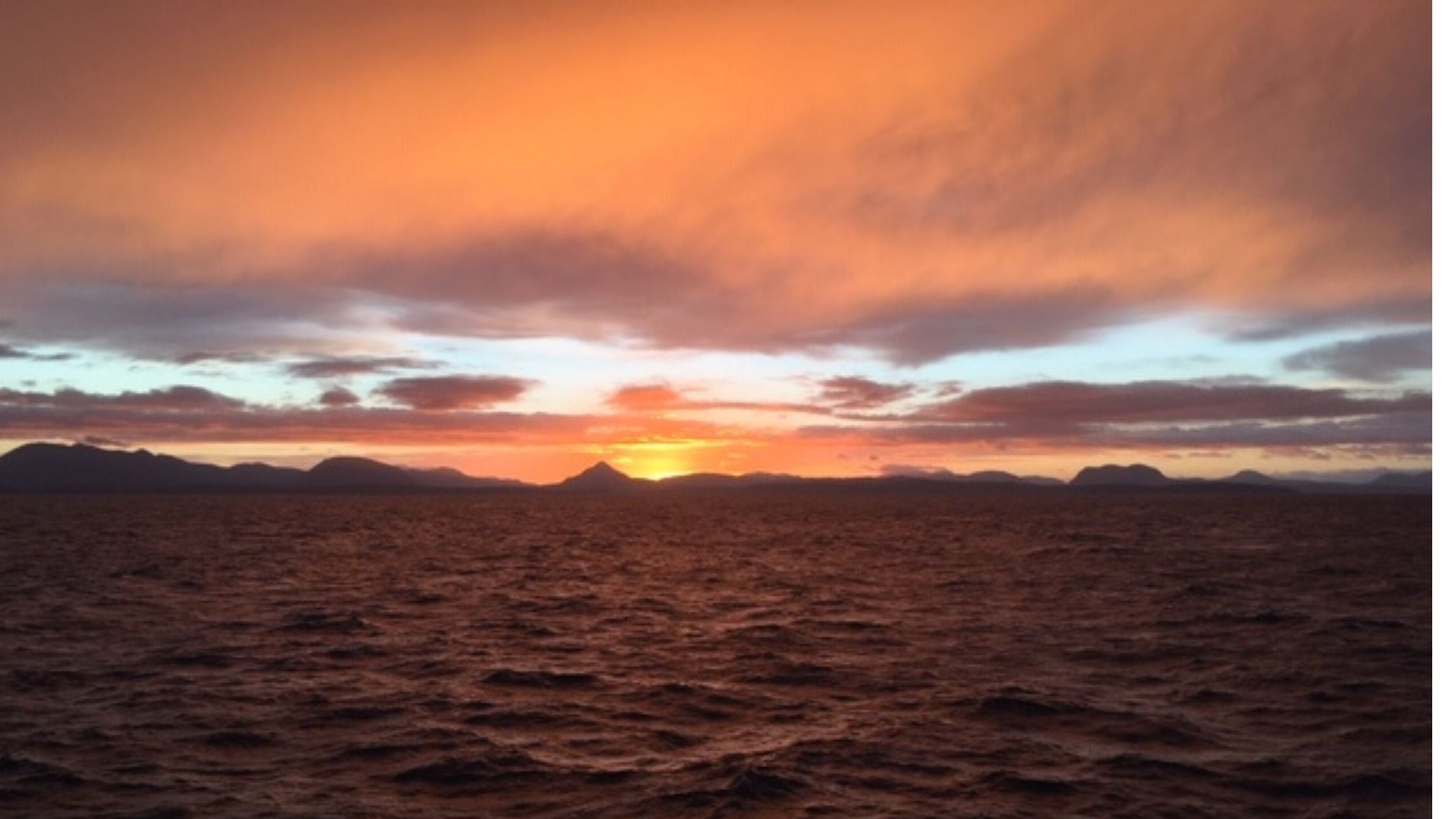 Sun setting at sea
