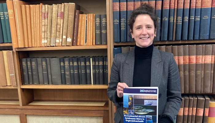 Cabinet Secretary for Rural Affairs, Islands and Land Reform Mairi Gougeon holding a copy of the Scottish Government’s new Marine Science and Innovation Strategy.