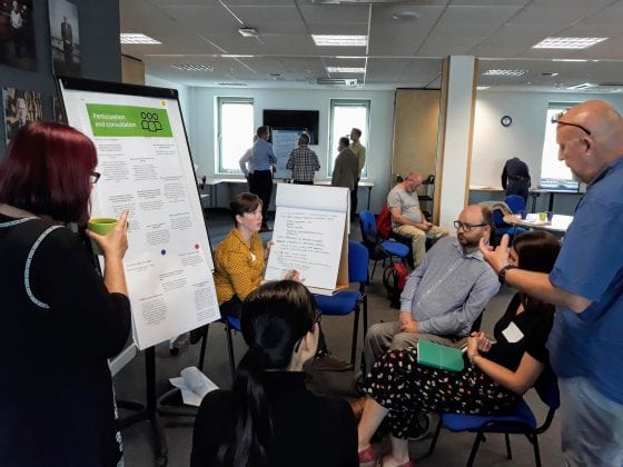 People discuss ideas and possible commitments on participation and improving consultation