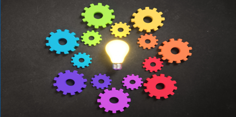 Lightbulb surrounded by multicolour cogs