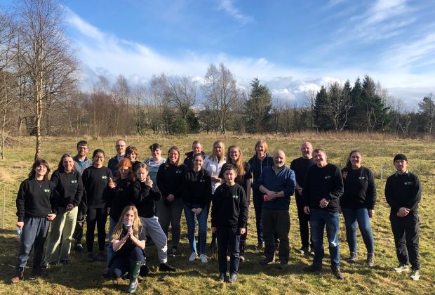 Young people's forest members standing outdoors in a group